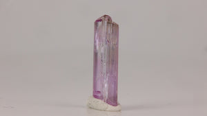 Light pink zoisite crystal with natural termination and transparency