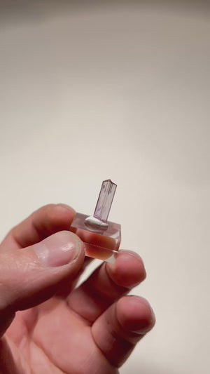 Orthorhombic zoisite crystal with soft pink hue and clean structure