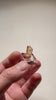 Brazilian topaz specimen with warm orange hues and natural termination