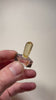 Tanzanian scapolite crystal with translucent body and honey yellow tones