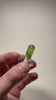Natural olivine peridot crystal showing vivid green color and inclusions