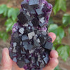 elongated Anhui fluorite display piece with lustrous purple crystals