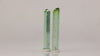 natural green tourmaline rods displayed as a collector pair