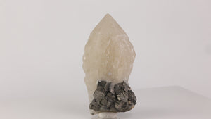 quartz crystal with silver metallic arsenopyrite base