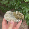 Metallic pyrite aggregates with translucent calcite crystals from China