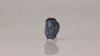Blue zoisite crystal rough with internal banding and natural inclusions