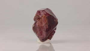 Natural zircon specimen showing equant crystal habit and internal reflections