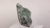 Translucent green fluorite crystals on dark matrix