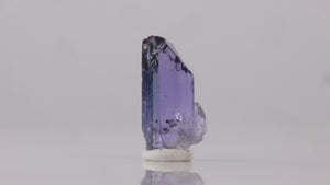 Raw natural tanzanite crystal specimen blue and purple