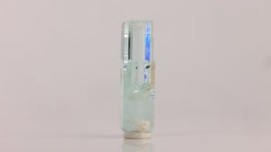 Reverse view of natural aquamarine from Skardu Valley displaying vertical striations and a sharply formed crystal termination.