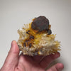 Large quartz specimen featuring reddish brown pyrite crystals