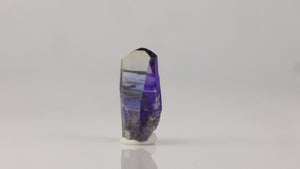 transparent natural tanzanite crystal with color zoning
