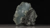 Pale blue prehnite specimen with dark contrasting matrix