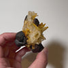 Dark metallic pyrite crystals on bright quartz matrix