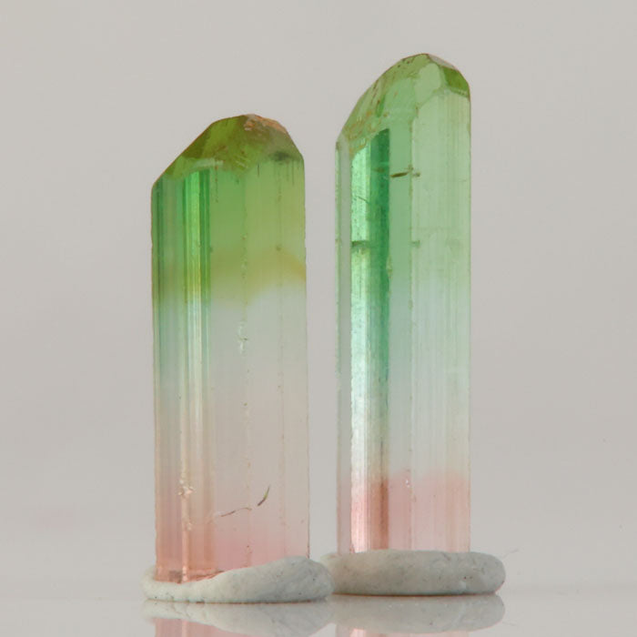 elongated tourmaline crystals with distinct green to pink fade