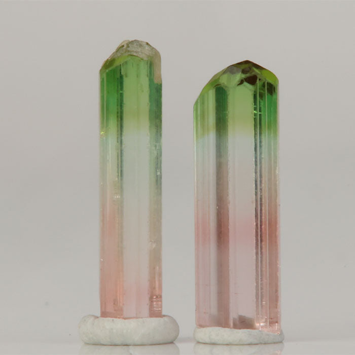 raw tourmaline pair from africa showing vertical striations