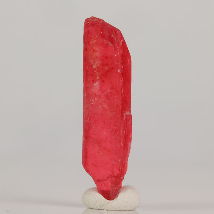 Triclinic rhodonite crystal with saturated pink color and smooth luster