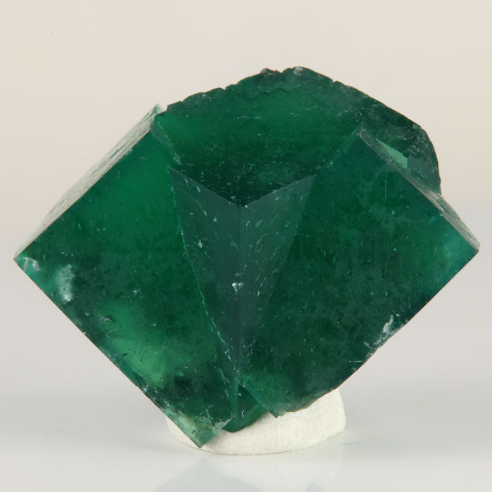 Deep green Rogerley Mine fluorite twin crystals weighing 37.76 grams with a broad fan-like arrangement of intergrown crystals.