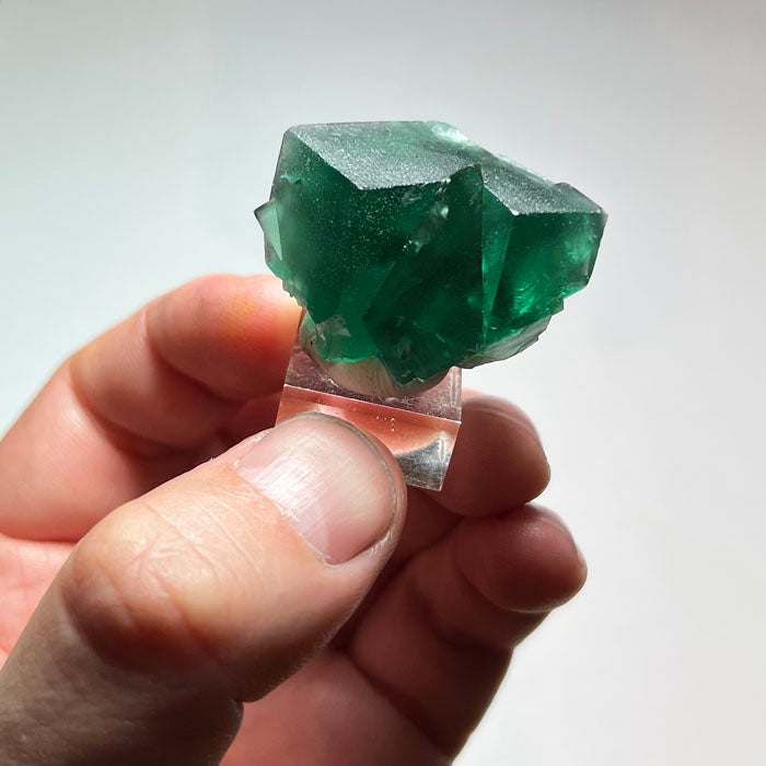 Reverse angle of 30.74 gram Rogerley fluorite displaying flat crystal faces, subtle surface texture, and translucent green edges.