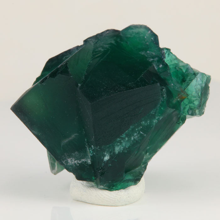 Deep emerald green Rogerley fluorite specimen with large intergrown cubic crystals from Weardale, England.