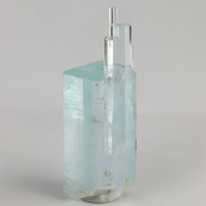Aquamarine crystal cluster from Shigar Mine Pakistan with slender crystals extending above a larger blue crystal.