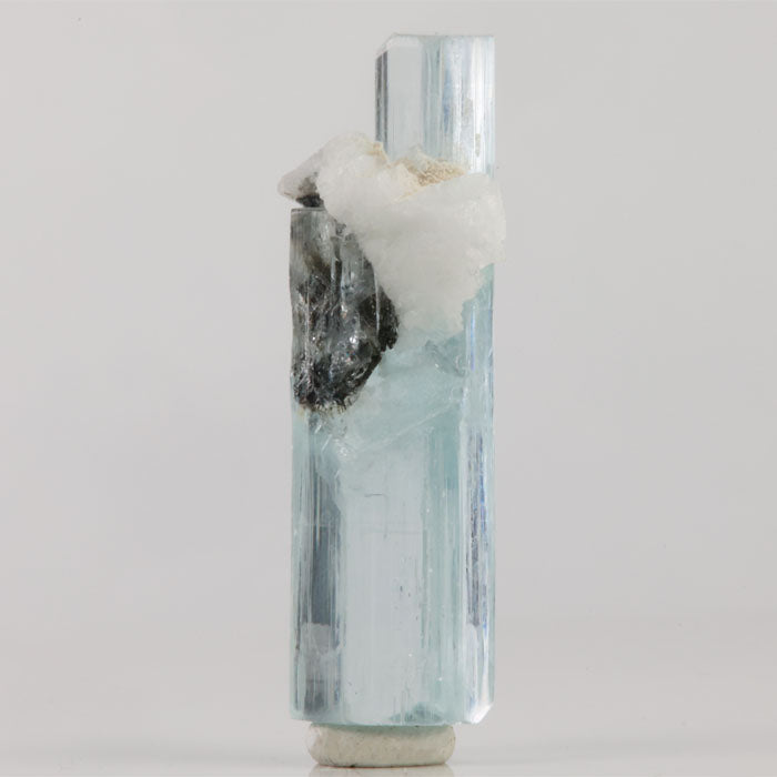 Natural aquamarine thumbnail specimen from Skardu Valley displaying a slender crystal with terminations at both ends.