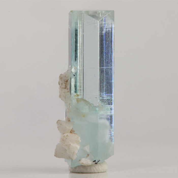 Reverse view of natural aquamarine from Skardu Valley displaying vertical striations and a sharply formed crystal termination.