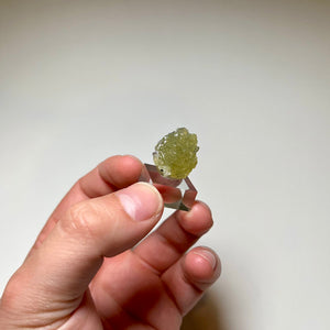 Tanzanite crystal partially covered by Prehnite