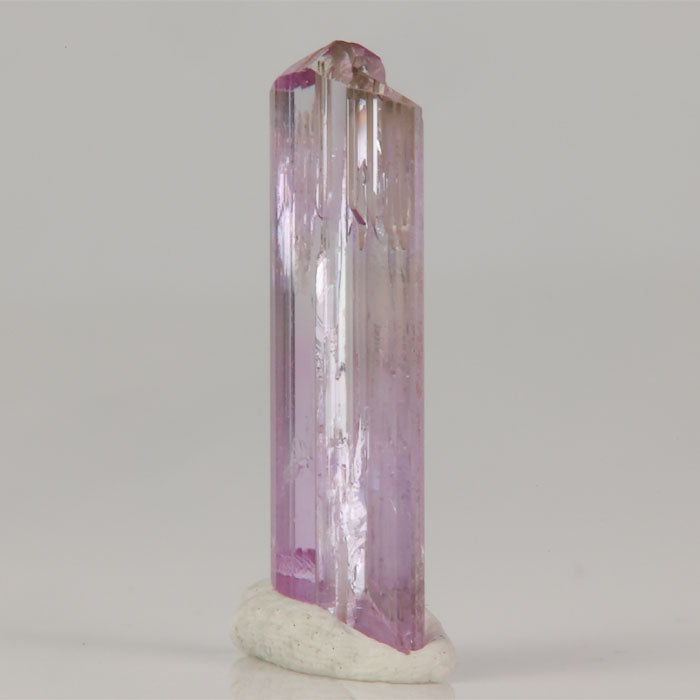 Tanzanite crystal showing pastel pink color and vertical striations