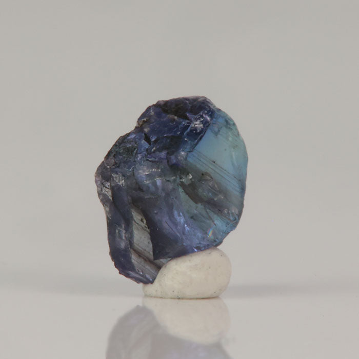 Blue zoisite crystal rough with internal banding and natural inclusions
