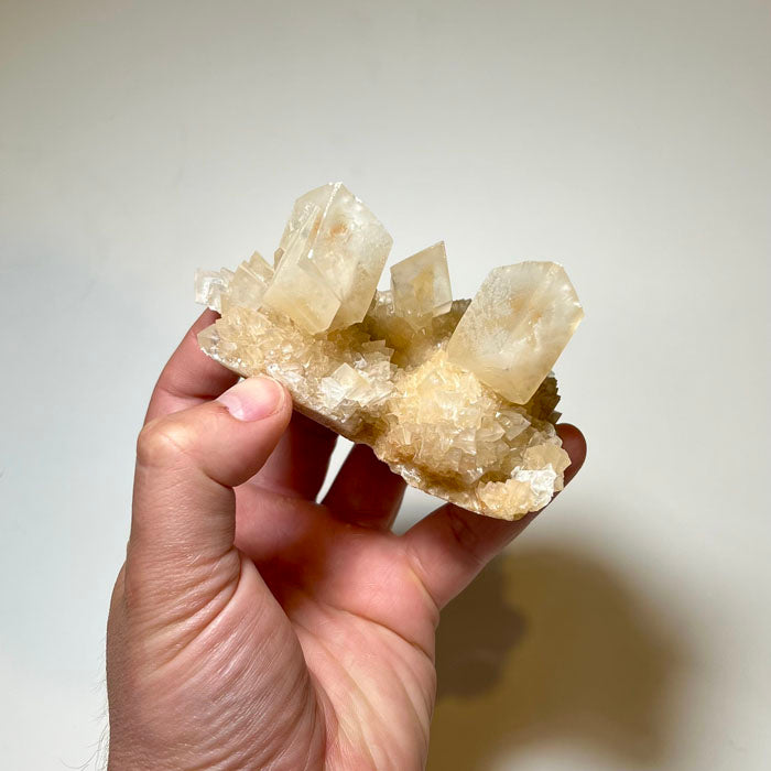 Terminated calcite crystals on sparkling peach calcite matrix