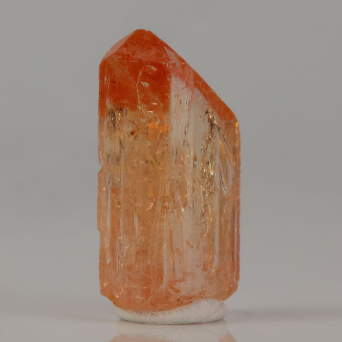 Topaz crystal with translucent body and internal growth features