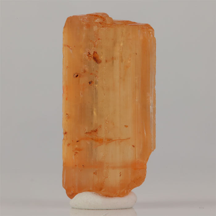 Topaz crystal with translucent body and visible internal inclusions