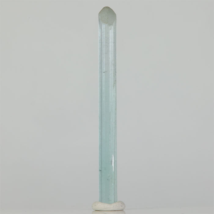 Elongated blue Elbaite crystal with natural termination
