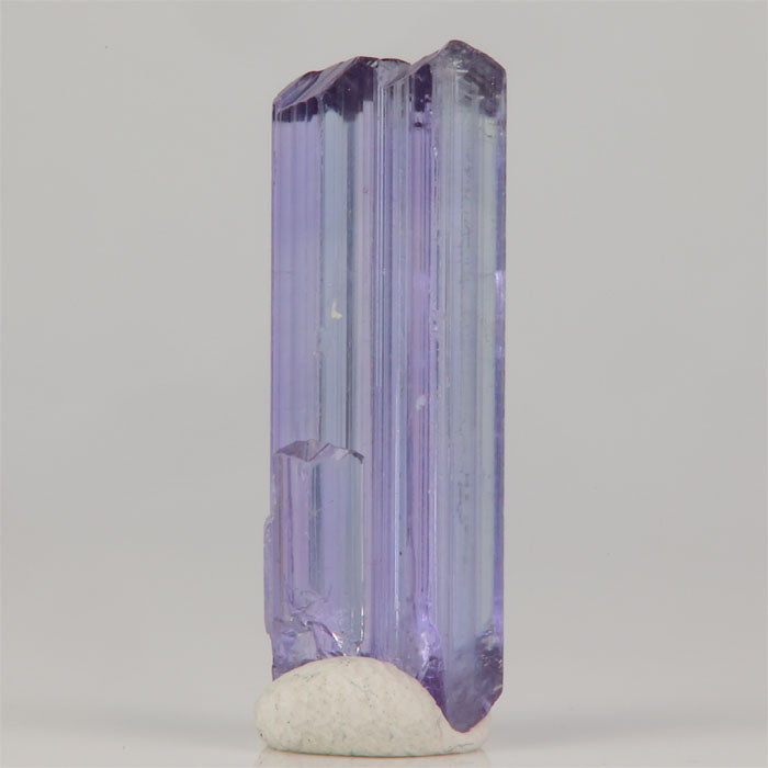 Unheated tanzanite crystal from Tanzania with violet blue color and prismatic form