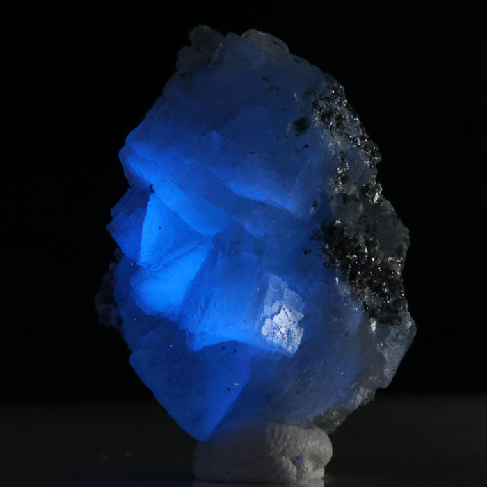 Blue prehnite crystal specimen displaying electric blue fluorescence