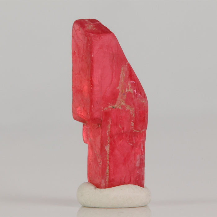 Bright pink rhodonite crystal specimen from Brazil with natural structure