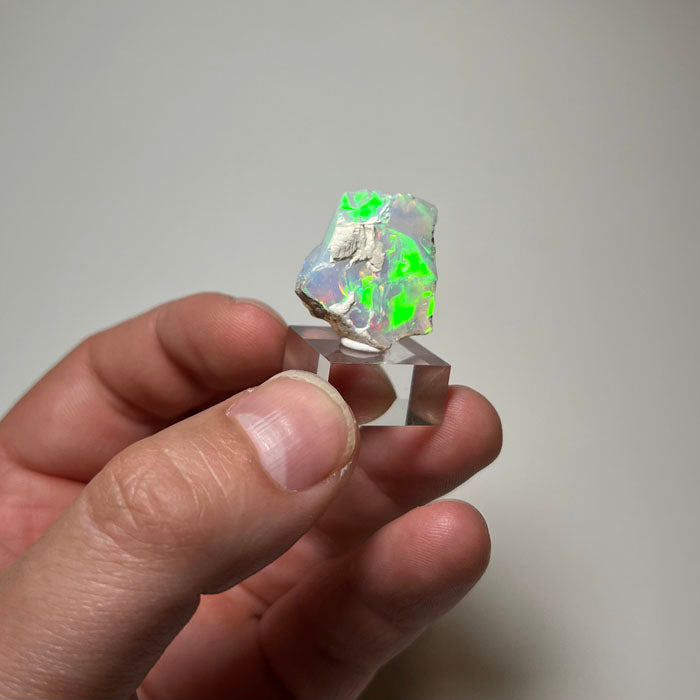 Natural Ethiopian opal displaying vivid green and blue fire