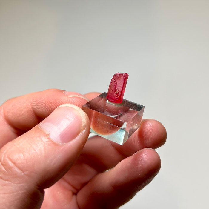 Bright raspberry colored Rhodonite crystal specimen