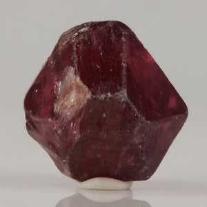 Tanzanian zircon crystal with reddish brown tones and natural inclusions
