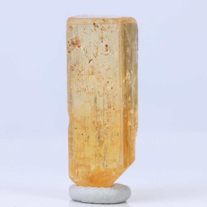Rough imperial topaz mineral specimen
