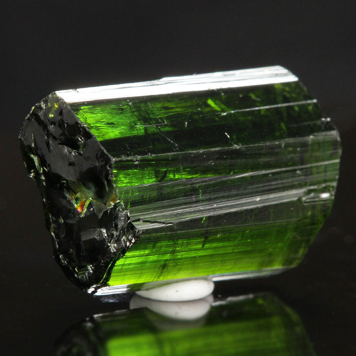 Raw green tourmaline crystal gemmy