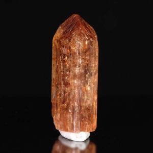 Raw imperial topaz crystal specimen