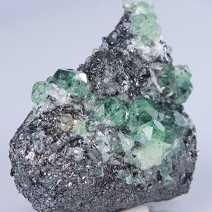 raw green garnet crystal mineral specimen grossular graphite