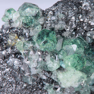 Merelani Garnet crystal mineral specimen on graphite host rock