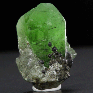 green peridot raw crystal specimen on matrix