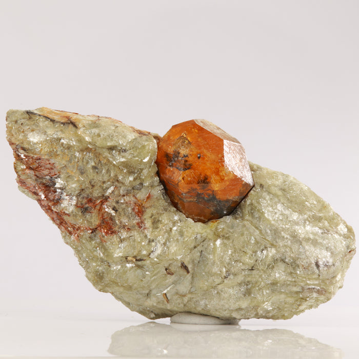 Tanzanian orange spessartite garnet crystal in matrix large