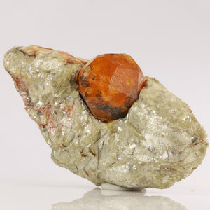 Natural Orange Spessartite Garnet Crystal in the Host Rock