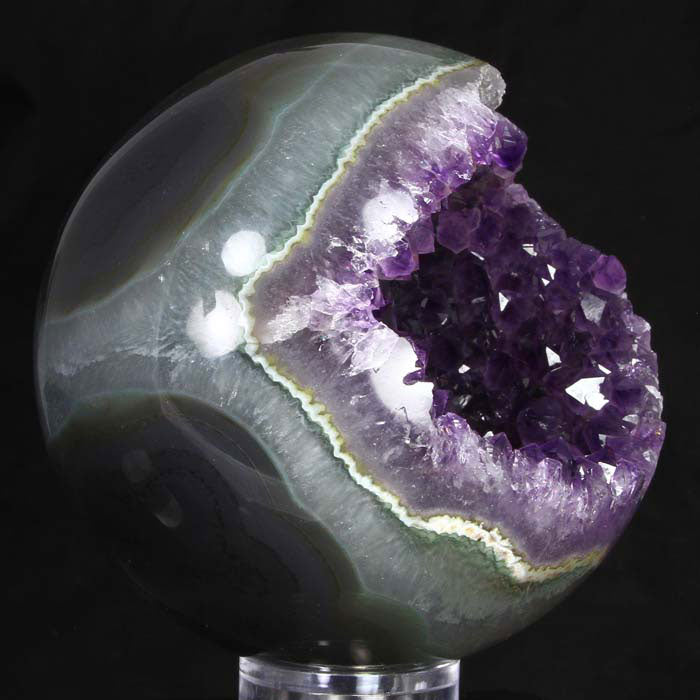 Polished amethyst sphere raw crystal